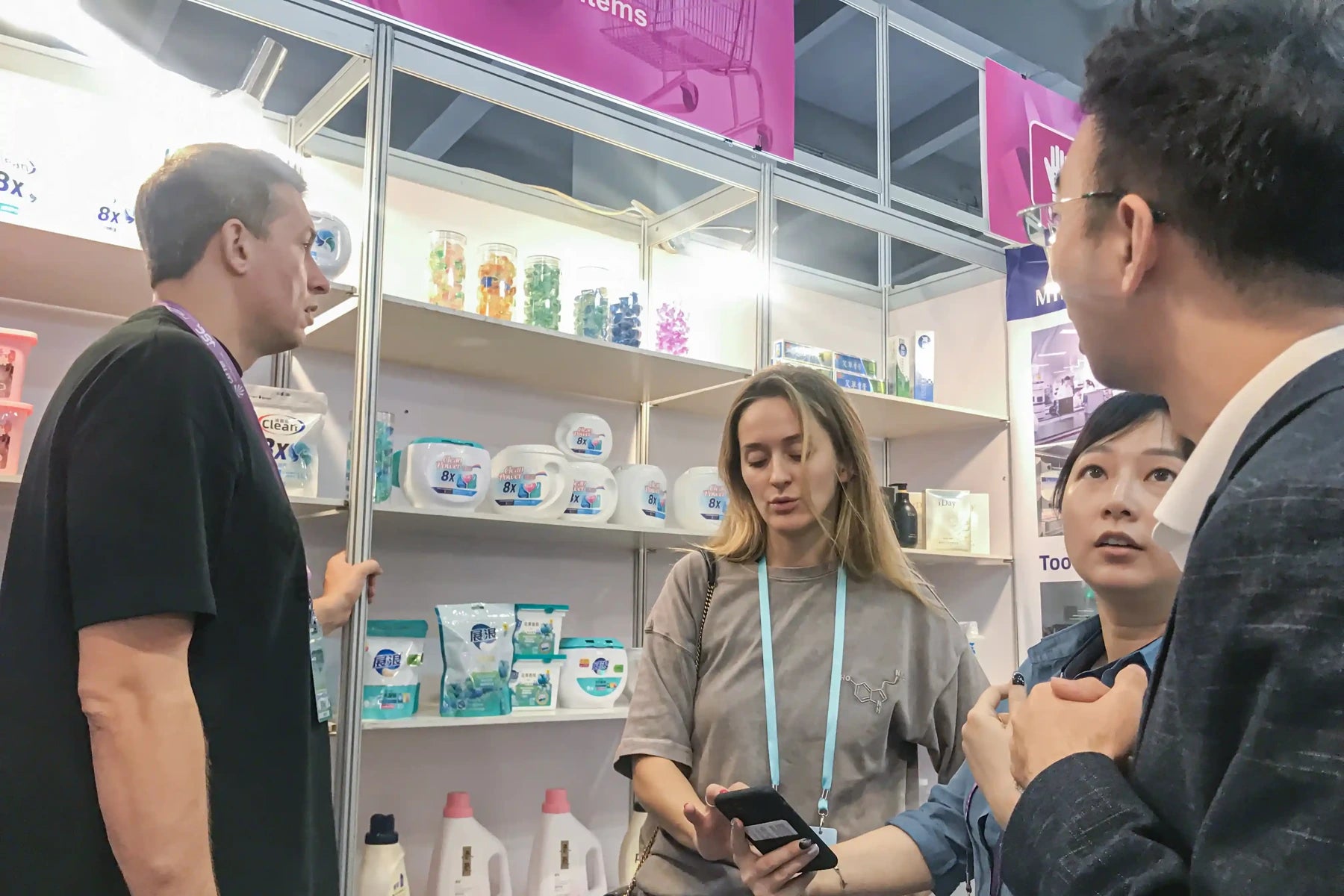 AUTHENTIC staff speaking with visitors at a trade show booth